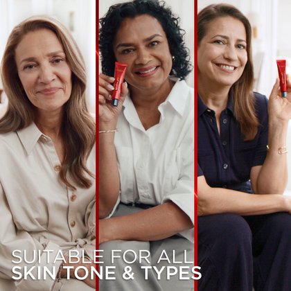 A triptych showing three different women, each with distinct skin tones and types, smiling confidently. The woman in the center panel holds the L'Oréal Revitalift Eye Bag Instant Eraser tube. The text at the bottom reads: "SUITABLE FOR ALL SKIN TONE & TYPES." Vertical red bars separate the three portraits.