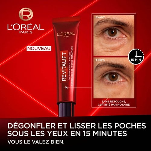 Une image promotionnelle pour L'Oréal Revitalift Correcteur de Poches Instantané. À gauche se trouve le tube rouge du produit avec le texte "NEW". À droite, deux images en gros plan de l'œil d'un homme, étiquetées "BEFORE" et "AFTER", montrant une réduction significative des poches et des rides sous les yeux après 15 minutes. Une icône d'horloge indique "15 MIN". Le texte déclare : "DEPUFFS & SMOOTHS EYE BAGS IN 15 MINUTES", "NO RETOUCHING NOTARY CERTIFIED" et "YOU'RE WORTH IT." L'arrière-plan est d'un rouge éclatant.