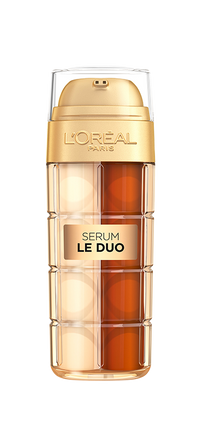  L'Oréal Paris Age Perfect Serum Le Duo bottle, featuring two chambers of golden liquid, suggesting a dual-formula serum. Text reads "2 Serums in 1," "Instant radiance, firmness and reduced look of wrinkles," and "You're worth it." The bottle is set against a background of flowing golden liquid, emphasizing its rich texture.